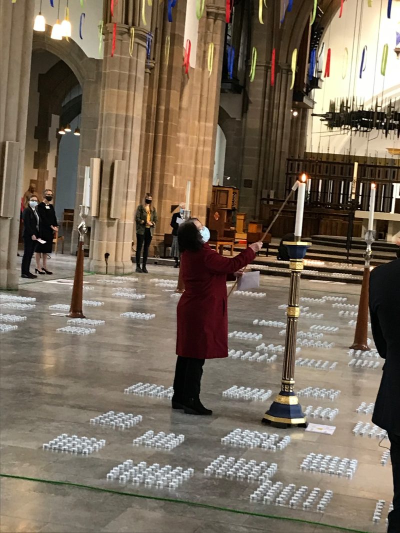 Kate Hollern lights a candle at Blackburn Cathedral